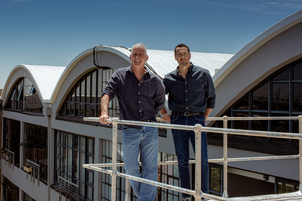 Jon Jacobson (left) and Anton Grutzmacher (right) co-founders of Omnisient standing on top floor outside Omnisient offices.